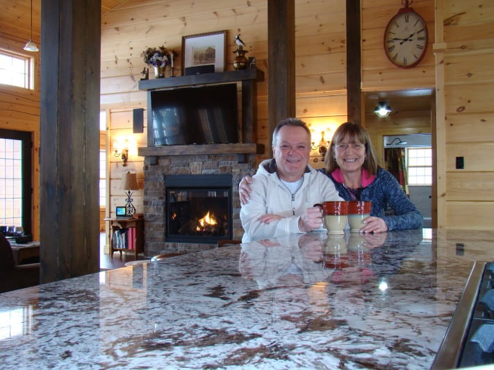 Serge and Monica beam from the kitchen lof their Confederation dream house